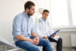 © Syda Productions - doctor and man with health problem at hospital