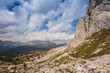 © Gianluca - Two trekkers along path with beautiful dolomitic landscape, Valparola Pass, Dolomites, Italy