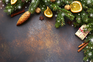 Dark brown christmas background with fir branches .Top view with copy space.