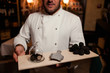 restaurant chef delicacy. truffle vegan food mushroom. waiter service meal concept