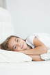 © Ermolaev Alexandr - Happy little girl lying on the bed