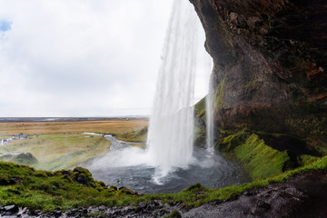 Wall Mural - wet path around Seljalandsfoss waterfall