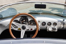 Close-up, Detailed Photo Of The Interior, Dashboard, Steering Wheel And Speedometer Of A Classic Oldtimer Luxury Sports Car.
