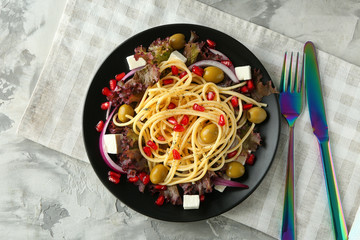 Canvas Print - Plate with fresh vegetable salad on table