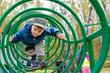boy playing at a children's playground
