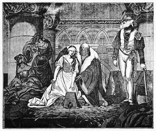 Fotografía Medieval beheading of Jane Grey, young woman accompained by a lord to the stump while the hangman wait for her