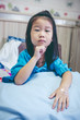 © kdshutterman - Unhappy illness asian child admitted in hospital. Vintage tone.
