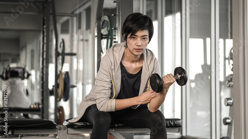Smiling Asian Short Hair Woman Fitness Dumbbell Lifting Exercise