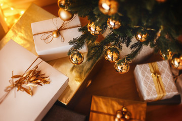 lovely christmas tree with beautifuly packed presents boxes under it