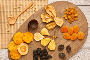 Wall Mural - Dried fruits on wooden background