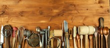 Old Kitchen Utensils On A Wooden Board. Sale Of Kitchen Equipment. Chef's Tools.