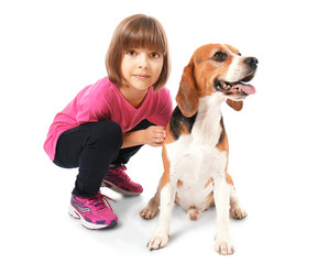 Cute little girl with dog on white background