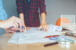 © joyfotoliakid - Engineer meeting for architectural project and working with partner engineering on workplace