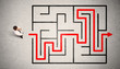 © ra2 studio - Lost businessman found the way in maze with red arrow