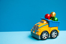Child Car Track With Christmas Candy On Blue Background. Xmas Concept.
