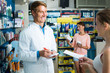 © JackF - man pharmacist in pharmaceutical shop .
