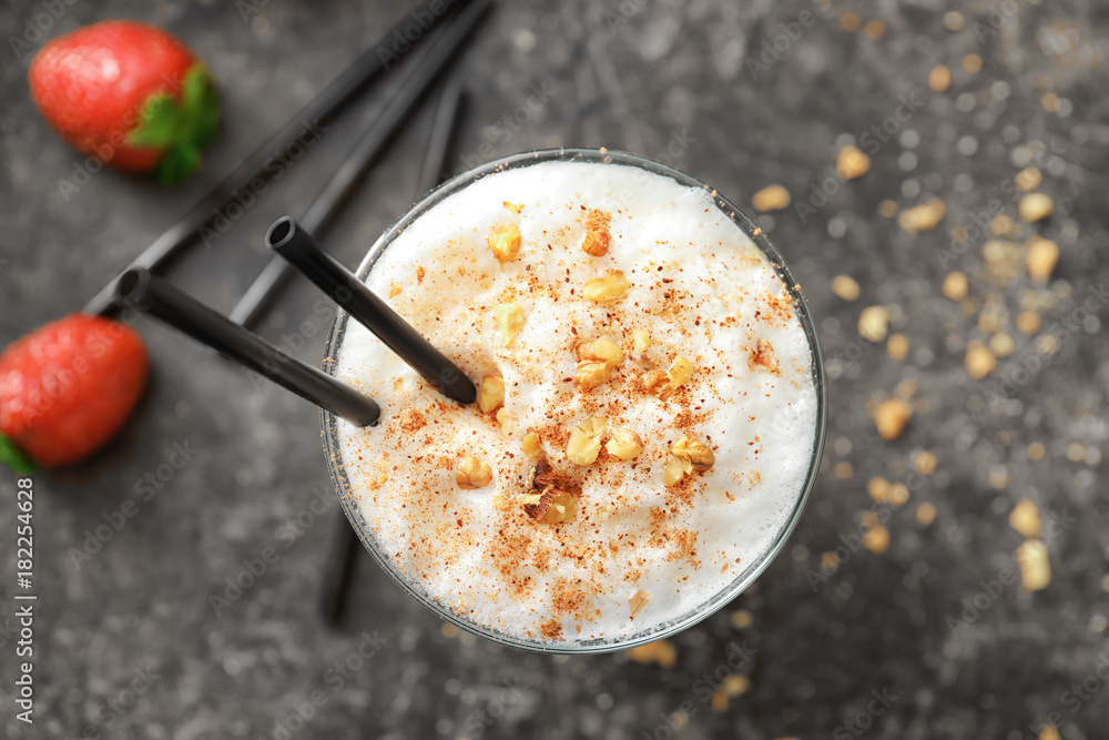 Tasty cocktail with coffee and caramel in glass on table