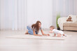 © Africa Studio - Young mother and cute baby playing on floor at home