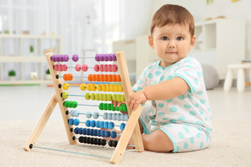 Wall Mural - Cute baby boy playing at home