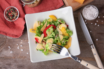 Wall Mural - Plate of tasty salad with Brussels sprouts on table