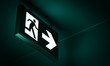 Emergency exit sign in corridor point way out of building - 3d render