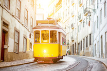 Street View With Famous Old Tourist Tram During The Sunny Day In Lisbon City, Portugal