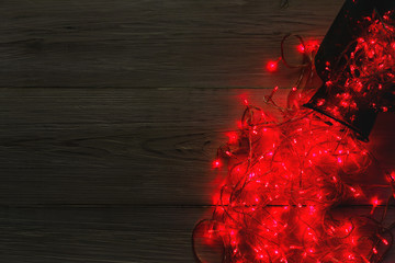 Wall Mural - Christmas lights border on wood background