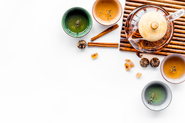 Tea break. Cookware fo tea ceremony. Tea pot and cups on white background top view copyspace