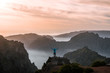 © Michael Schauer - Adult male hiker celebrating the sunset over the mountain panorama of Madeira, Portugal