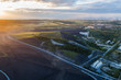 © nikwaller - Aerial view Oil refinery with a background of mountains and sky at sunset.