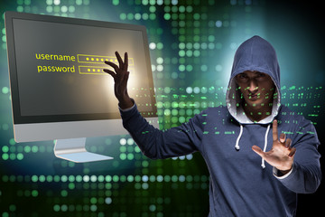hooded hacker in data computer security concept