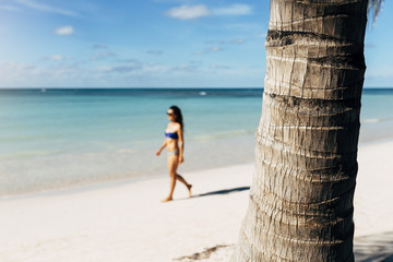 Wall Mural - Young woman relax on the beach.