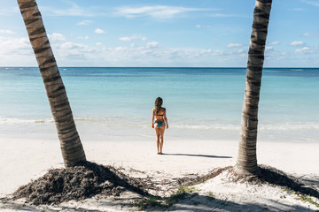 Wall Mural - Young woman relax on the beach.