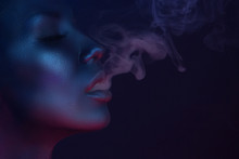 Vape Party, Nightlife. Beautiful Sexy Woman Smoking