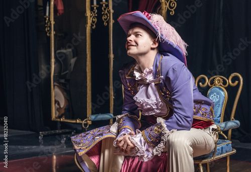 Fotografie, Tablou Actor dressed historical costume in interior of old theater.