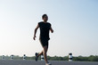 © xreflex - Asia young man running in the time during sunrise on dam road exercise.Healthy lifestyle