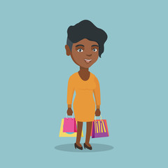 Wall Mural - Young happy smiling african-american woman holding shopping bags. Full length of cheerful woman standing with a lot of shopping bags. Vector cartoon illustration. Square layout.