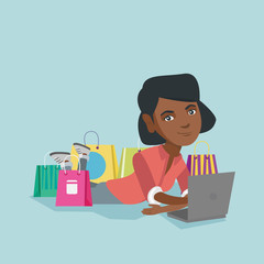 Poster - Young african-american woman using a laptop for online shopping