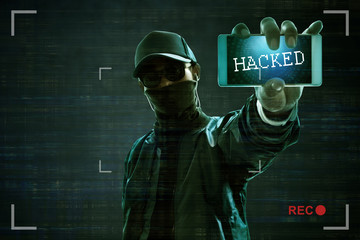 Wall Mural - Hacker holding mobile phone
