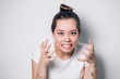 © liliyabatyrova - Close up isolated portrait of young annoyed angry woman holding hands in furious gesture. Young female in white T-shirt. Negative human emotions, face expressions. Film effect