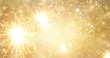 © ipopba - Abstract gold bright fireworks and sparkler on new year background