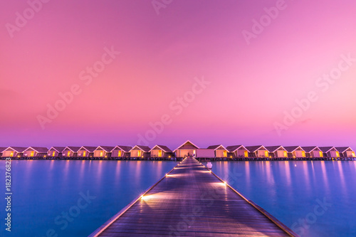 Fotomural Sunset on Maldives island, water villas resort