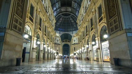 Wall Mural - Entrance to the Galleria Vittorio Emanuele II timelapse from Via Tommaso Grossi at night.