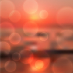 Wall Mural - Blurred sea sunset background with light on lens