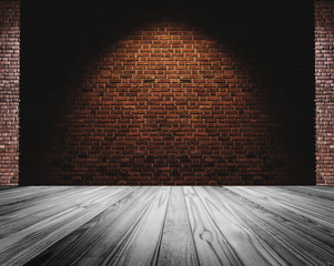 Brick wall and white floor, light spot on center for background