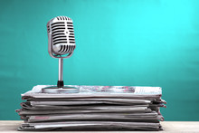 Retro Microphone With Newspaper On Wooden Table - Announcement Concept