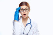© SHOTPRIME STUDIO - Young beautiful woman on white isolated background in medical alate, doctor, medicine, stethoscope, emotions, portrait