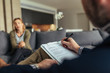 © Jacob Lund - Psychologist writing notes during a therapy session with patient