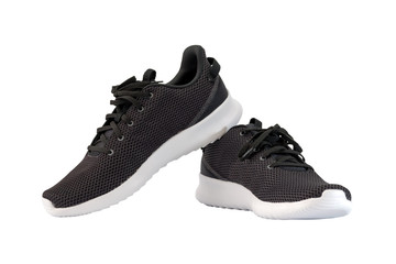 Black sneakers running shoes isolated on white background, with clipping path.