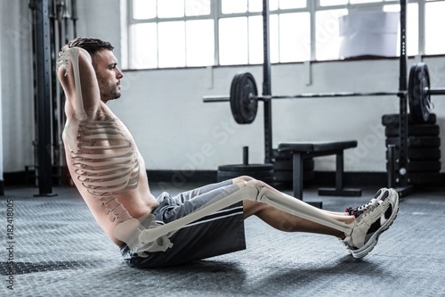 Fotografía Highlighted bones of exercising man at gym